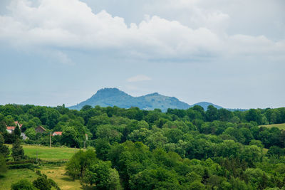 View of the chain of auvergne volcanoes under a thunderstorm