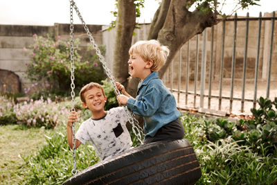 Kids enjoying swing at park