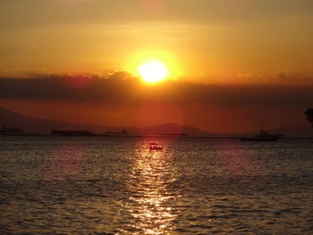 Scenic view of sea at sunset