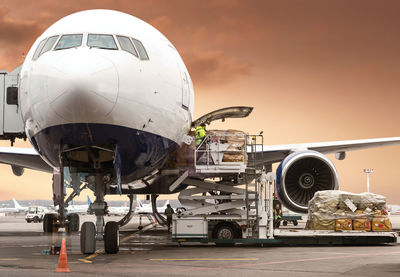 Close-up of airplane at airport runway