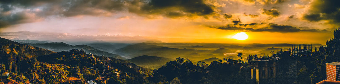 Scenic view of mountains against sky during sunset