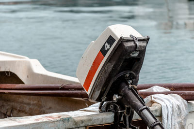 Close-up of retro outboard motor on old boat