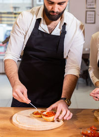 Chef preparing food on table