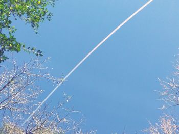 Low angle view of vapor trail against clear sky