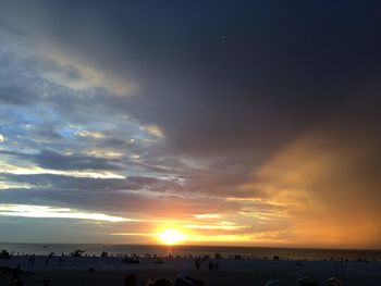 Scenic view of silhouette field against sky during sunset