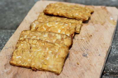 High angle view of bread on cutting board