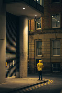 Rear view of woman walking in city