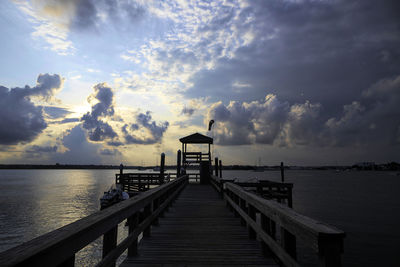 Pier over sea against sky