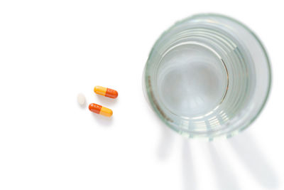 High angle view of glass bottle on white background