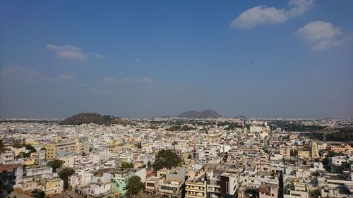 Aerial view of town against sky