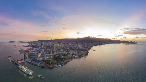 High angle view of sea against sky during sunset