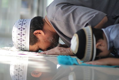 Muslim family praying to god