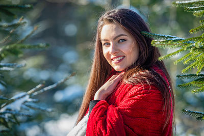 Portrait of a smiling young woman in winter