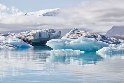 Icebergs at jökulsárlón glacier lagoon, iceland. vatnajökull in the background. 
