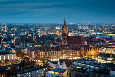 High angle view of illuminated buildings in city