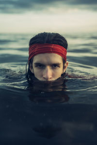 Portrait of woman swimming in sea