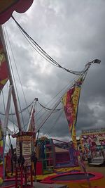 Low angle view of ferris wheel against sky