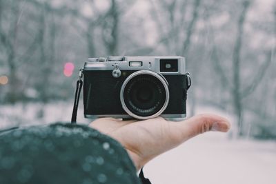 Close-up of hand holding camera