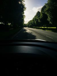 Road passing through forest