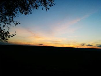 Silhouette landscape against scenic sky