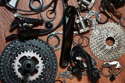 Close-up of bicycle chains and gears on table