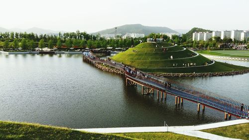 High angle view of river by city against sky