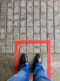 Low section of person standing on street