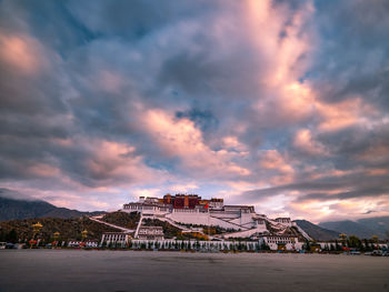 Traditional building against sky during sunset