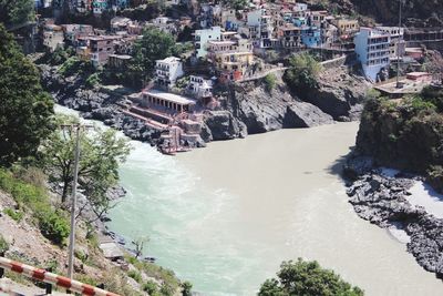 High angle view of buildings by sea