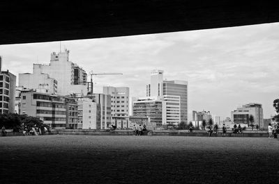 City street and buildings against sky