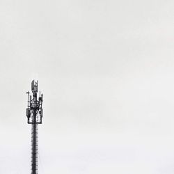 Low angle view of telephone pole against clear sky