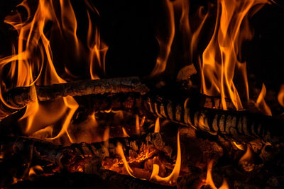 Close-up of fire burning at night