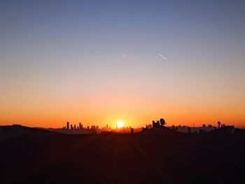 Scenic view of silhouette landscape against sky during sunset