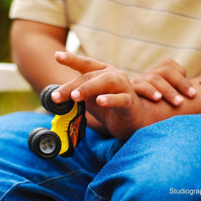 person, holding, part of, cropped, human finger, lifestyles, indoors, men, leisure activity, close-up, midsection, togetherness, love, focus on foreground, childhood, bonding