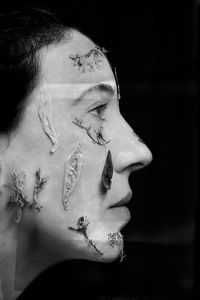 Close-up portrait of young woman looking away