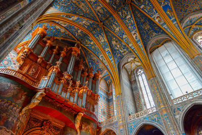 Low angle view of ornate ceiling in temple