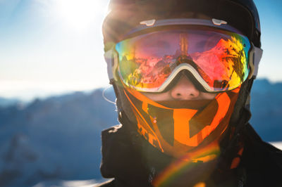 Portrait of a healthy woman in a sports mask looking directly at the camera against the backdrop of