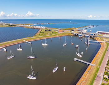 Aerial from saiing lboats waiting at the sluices at kornwerderzand in the netherlands