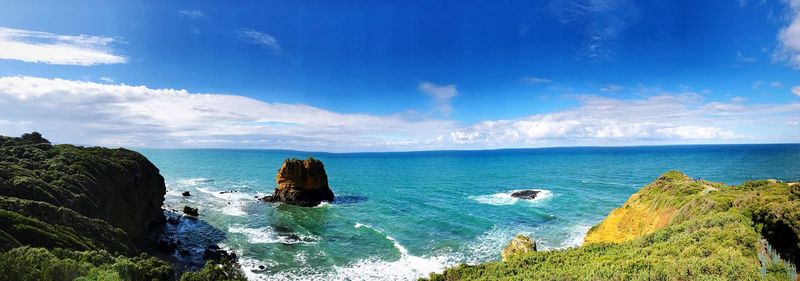 Scenic view of sea against blue sky