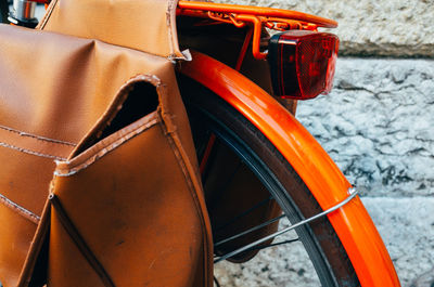 Close-up of orange bicycle tire on white background