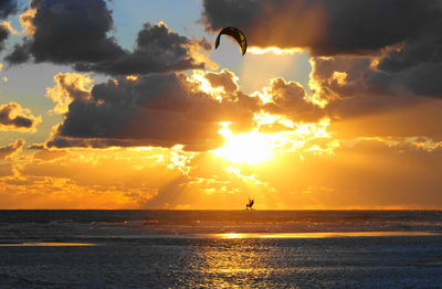 Beach against sky during sunset