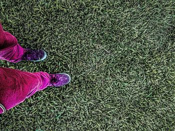 Low section of woman standing on tiled floor