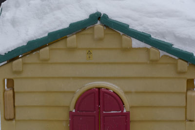Close-up of red door of building