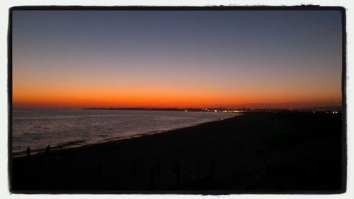 Scenic view of sea at sunset