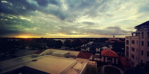 Aerial view of town against sky during sunset