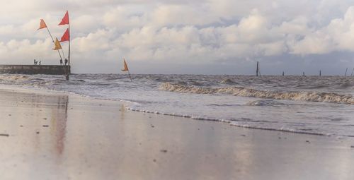 Scenic view of beach against sky