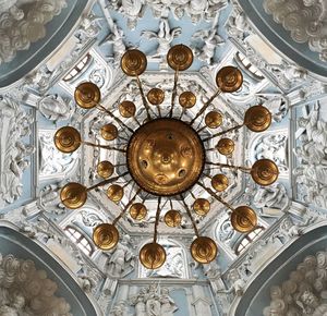 Low angle view of chandelier on building