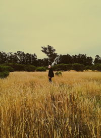 Man on field against sky