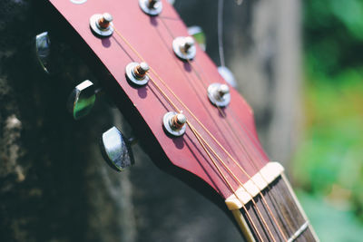 Close-up of guitar tuning pegs