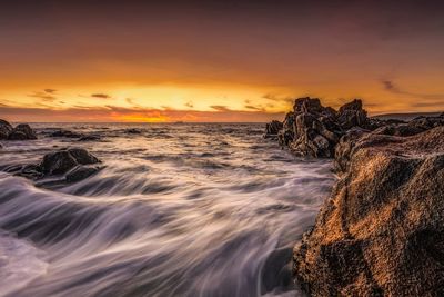 Scenic view of sea against sky during sunset